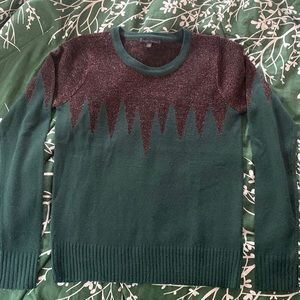 Good condition sweater.  Fits more like a small.